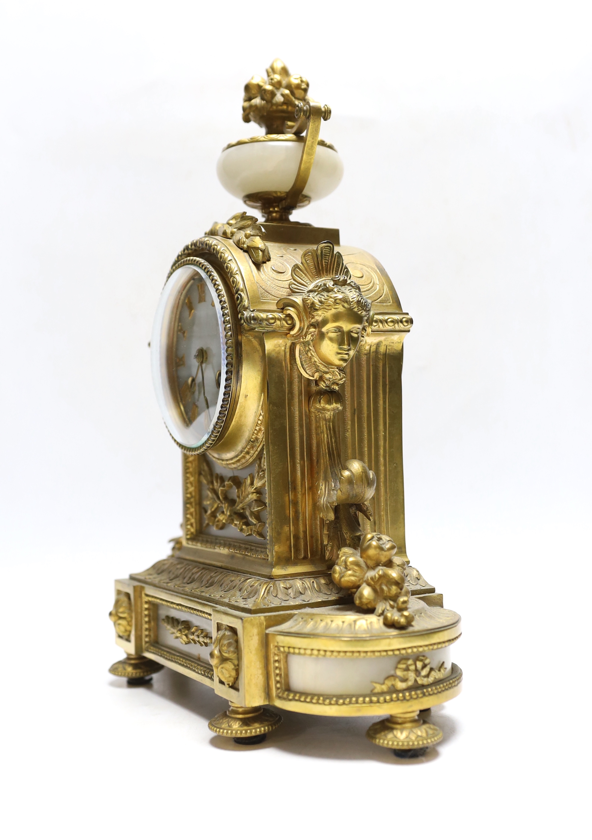 A late 19th century French gilt metal and alabaster mantel clock, 34cm